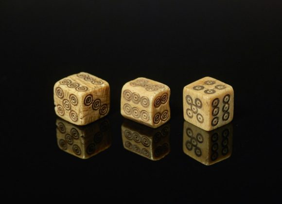The History of Gambling and Human Psychology: From Ancient Dice to Modern Addiction Science — Photo by Birmingham Museums Trust on Unsplash
