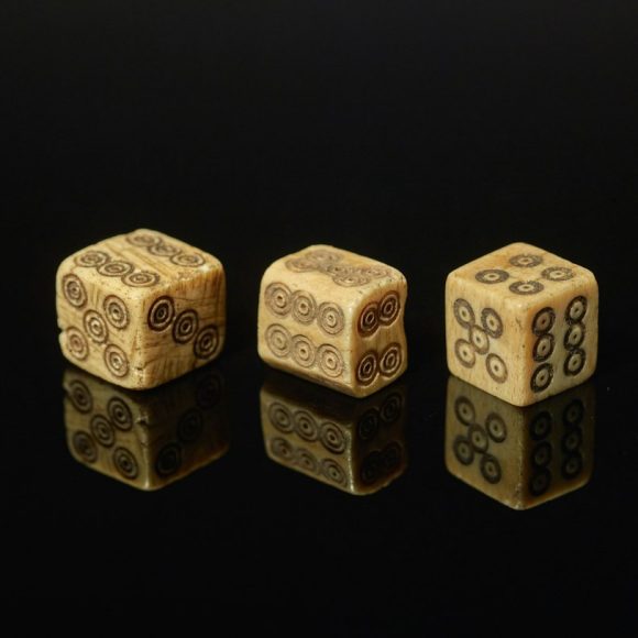 The History of Gambling and Human Psychology: From Ancient Dice to Modern Addiction Science — Photo by Birmingham Museums Trust on Unsplash